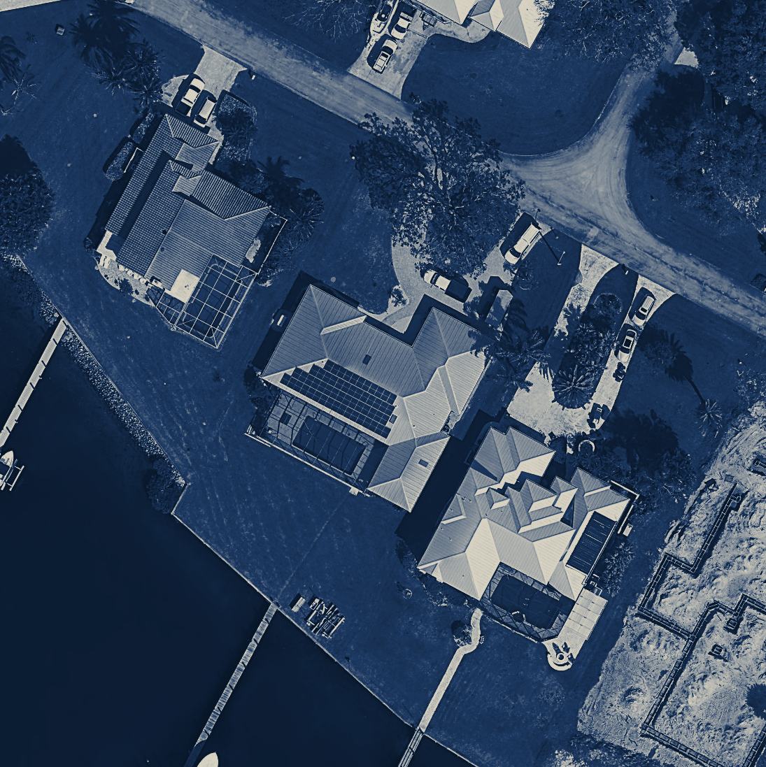 Navy-toned aerial plate of a waterfront Florida estate and its roof