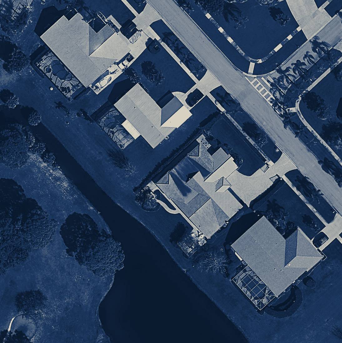 Navy-toned county orthoimagery of waterfront Treasure Coast homes and their roofs